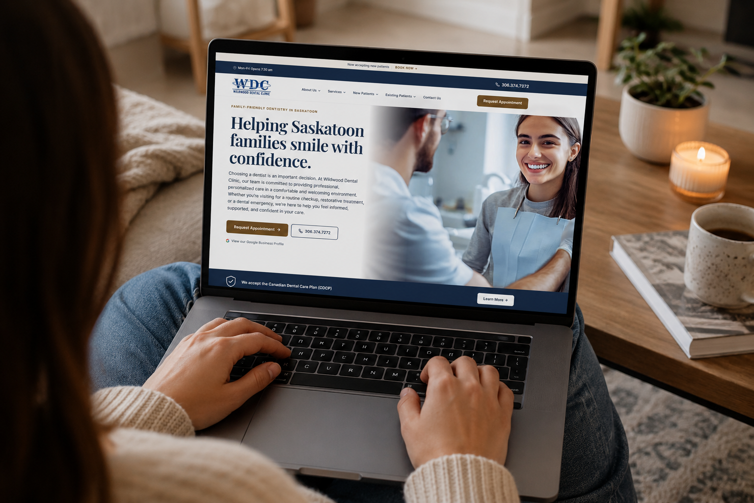 Person browsing the new Wildwood Dental Clinic website on a laptop