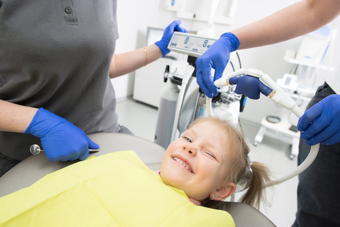 Pediatric dental treatment in progress