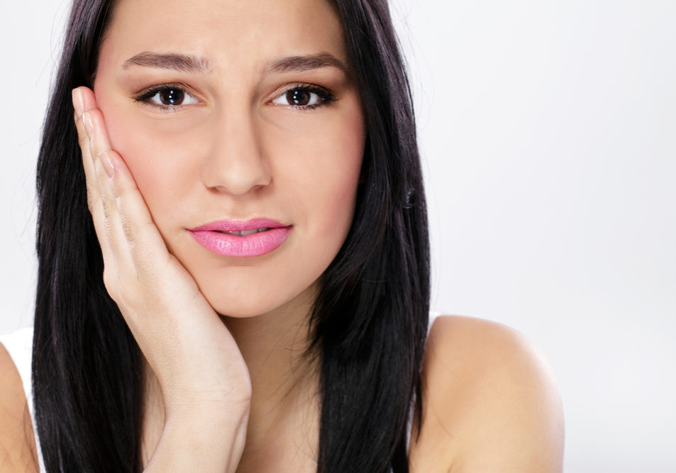 Young woman with toothache