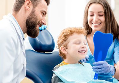 little-boy-and-mom-visit-the-dentist